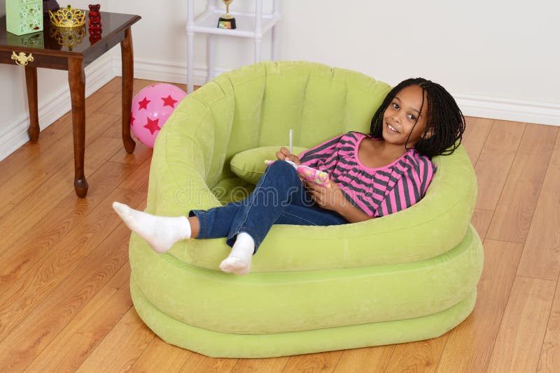Happy Young Black Child Relaxing Stock Photo - Image of pink, girl