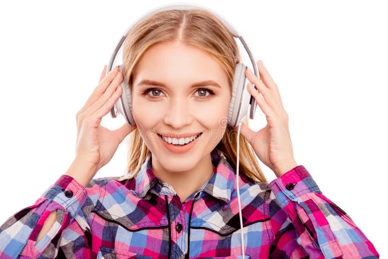 Happy young blonde woman listening music with headphones royalty free stock images Happy young blonde woman listening music with headphones royalty free stock images