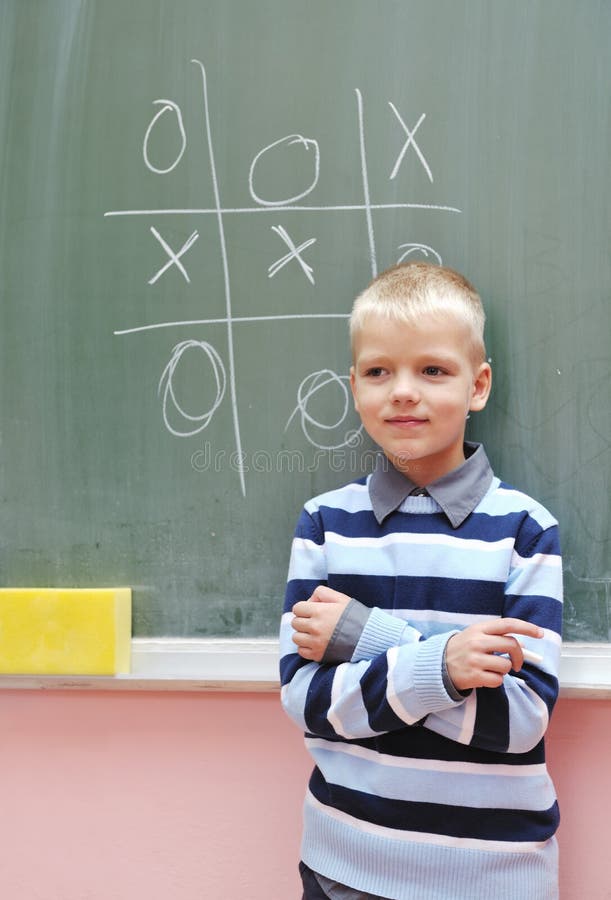 Happy young boy at first grade math classes stock image