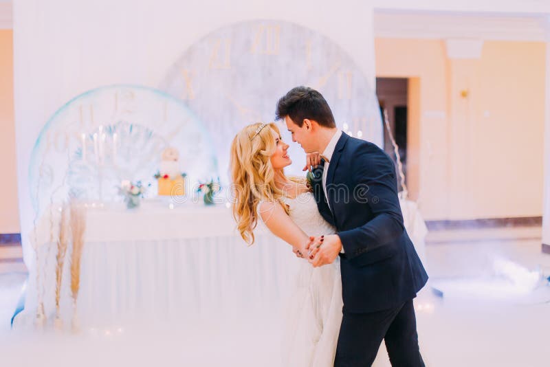 Happy young bride and groom dance in the wedding hall royalty free stock image Happy young bride and groom dance in the wedding hall royalty free stock image