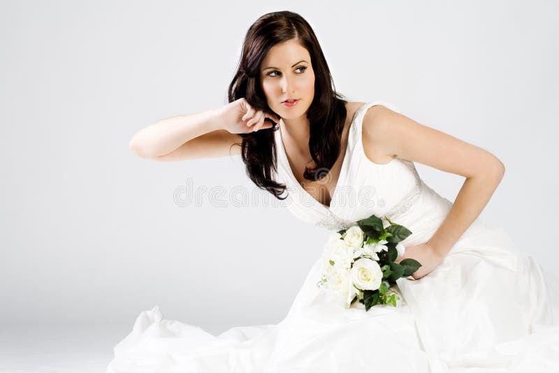 Happy young bride in wedding dress with bouquet stock photos Happy young bride in wedding dress with bouquet stock photos