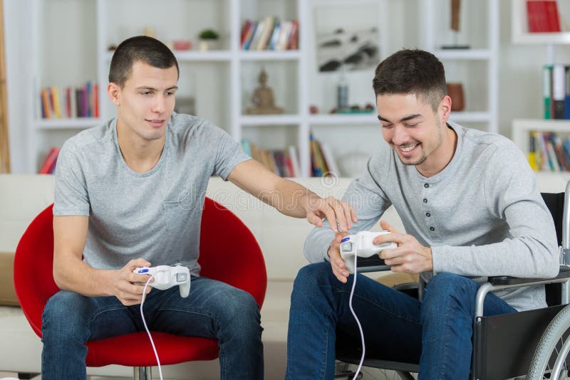 Happy young brothers playing video games stock images Happy young brothers playing video games stock images