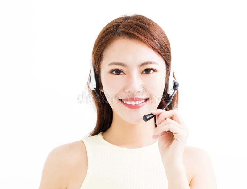 Happy young asian business woman wearing headset