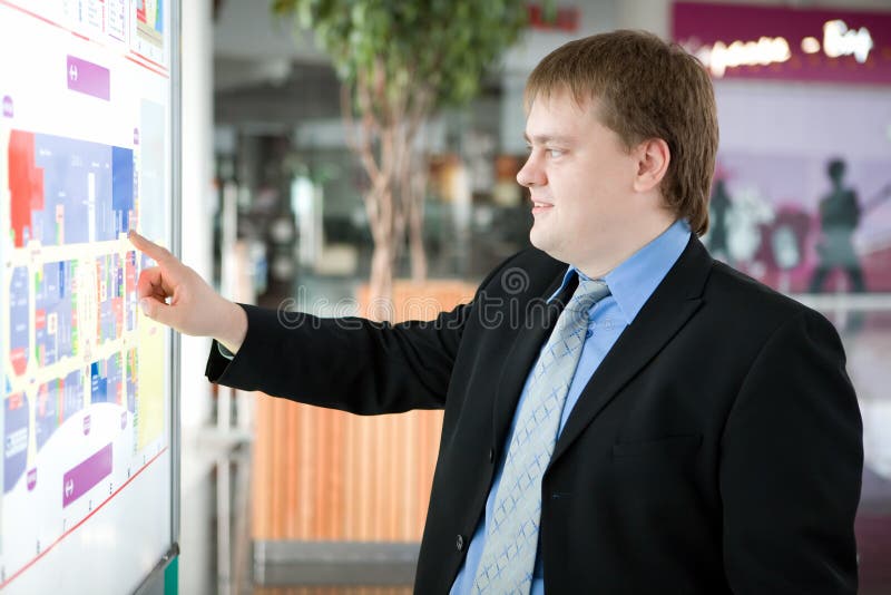 Happy young businessman with laptop