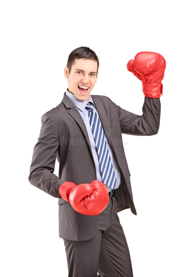 Happy young businessman with red boxing gloves stock images Happy young businessman with red boxing gloves stock images