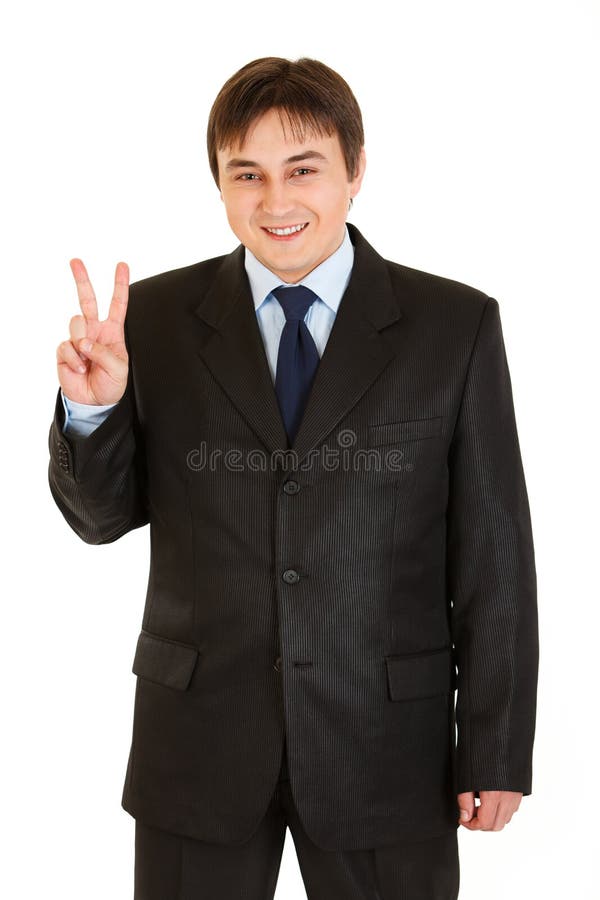 Happy young businessman showing victory gesture stock images Happy young businessman showing victory gesture stock images