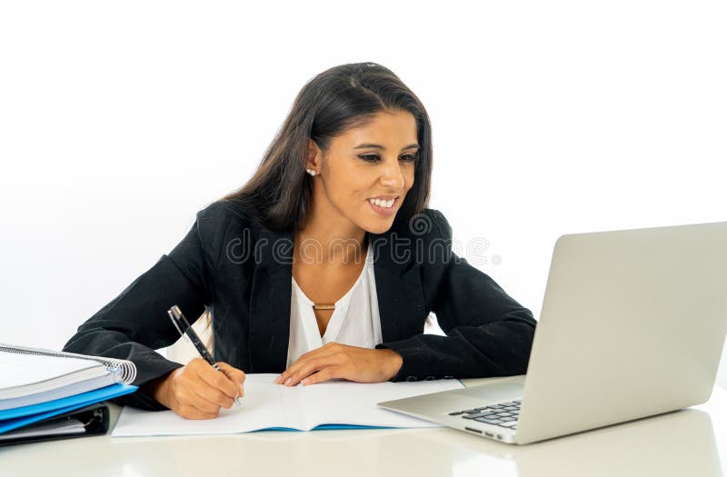 Happy young businesswoman working on her computer on her desk in satisfied at work and successful woman isolated on white