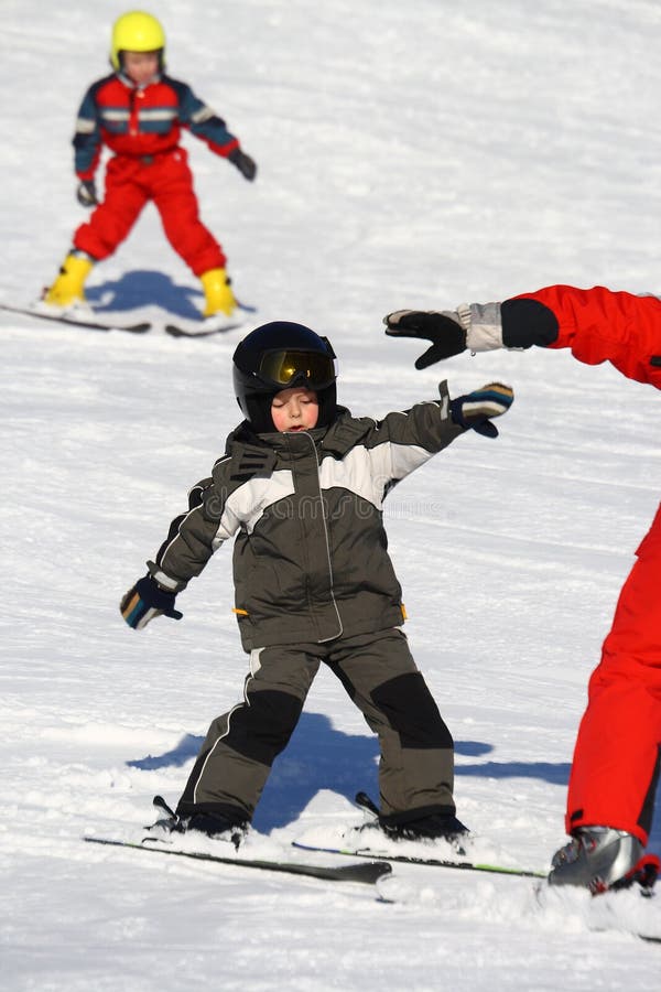 Happy young child skiing