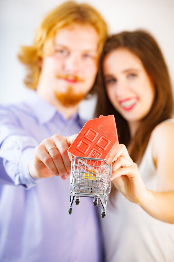 Happy young couple buying real eastate stock photos