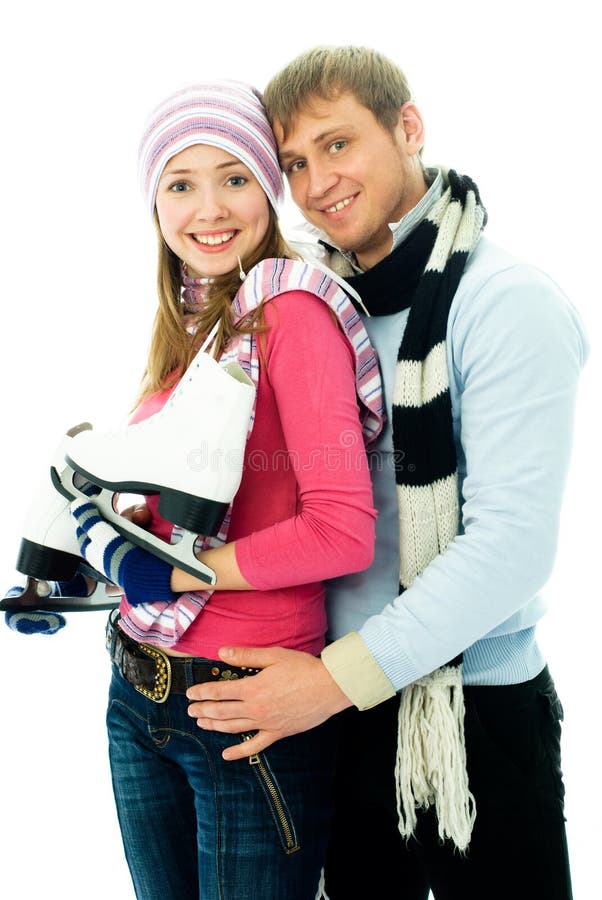 Happy young couple going ice-skating