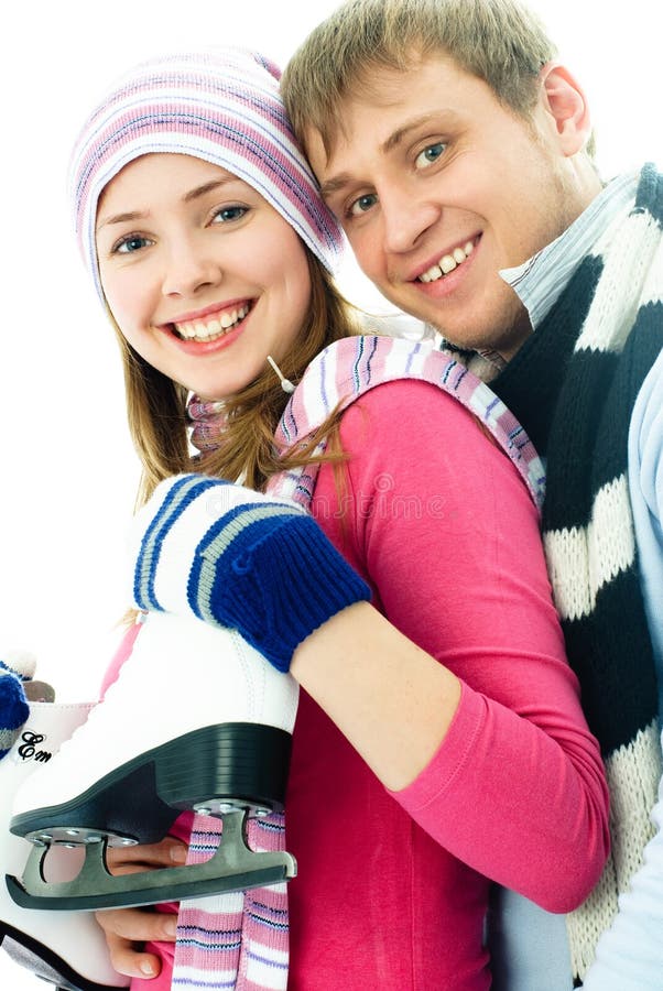 Happy young couple going ice-skating