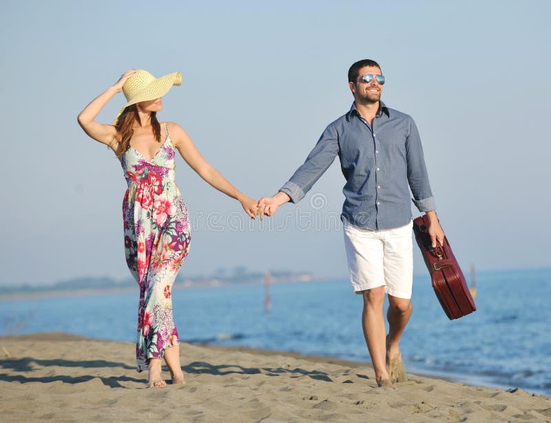 Happy young couple have romantic time on beach