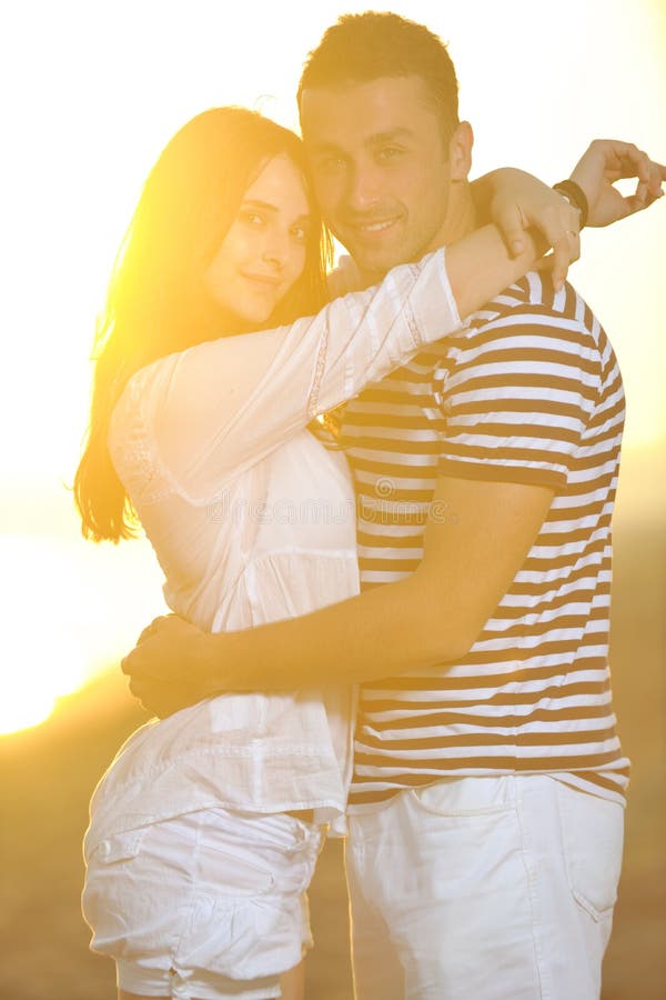 Happy young couple have romantic time on beach