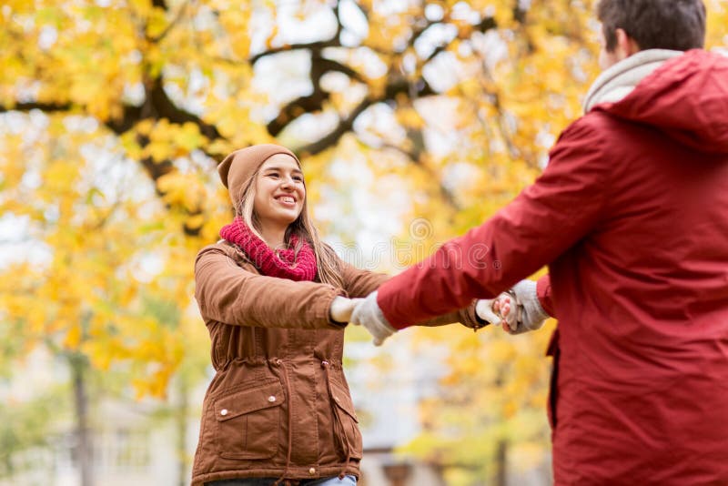 Happy Young Couple Having Fun In Autumn Park Stock Photo Image Of