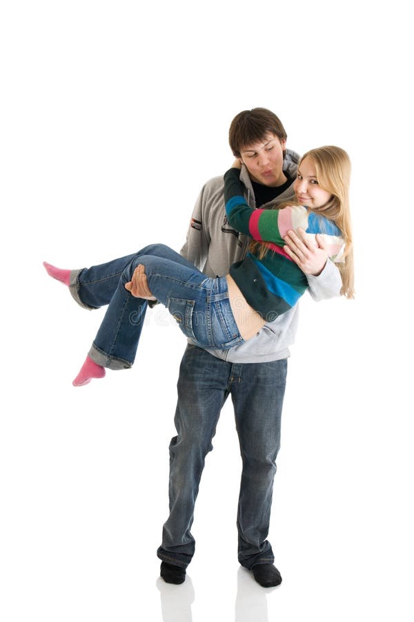 The happy young couple isolated on a white