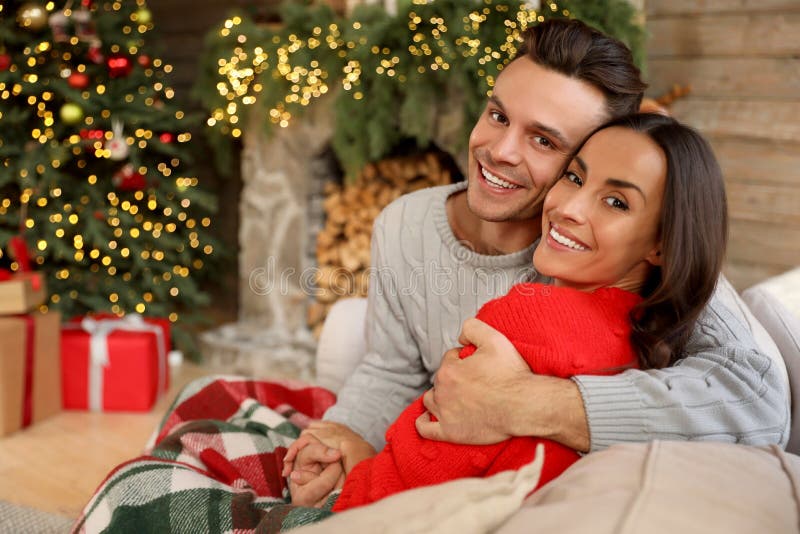 Couple in Living Room Decorated for Christmas Stock Image - Image of ...