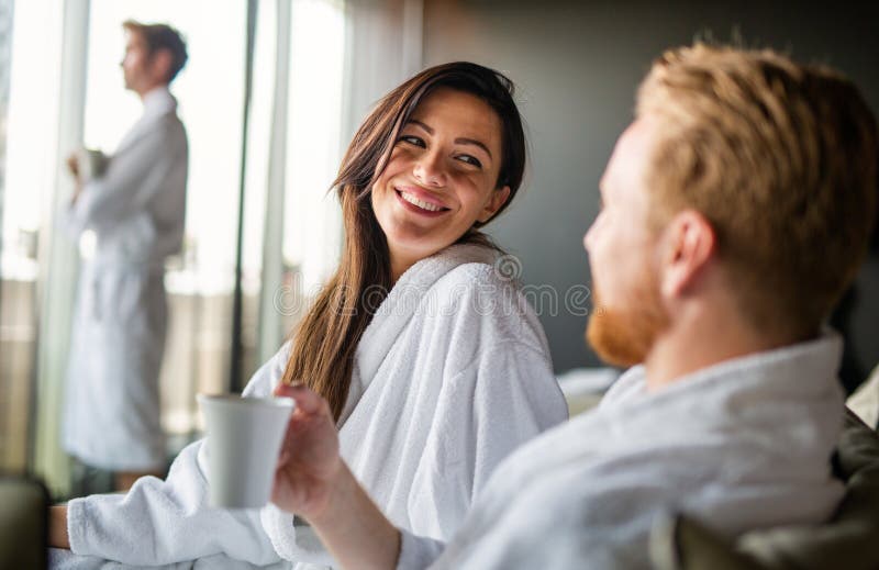 Happy young couple in love enjoying wellness spa resort treatments. stock photography