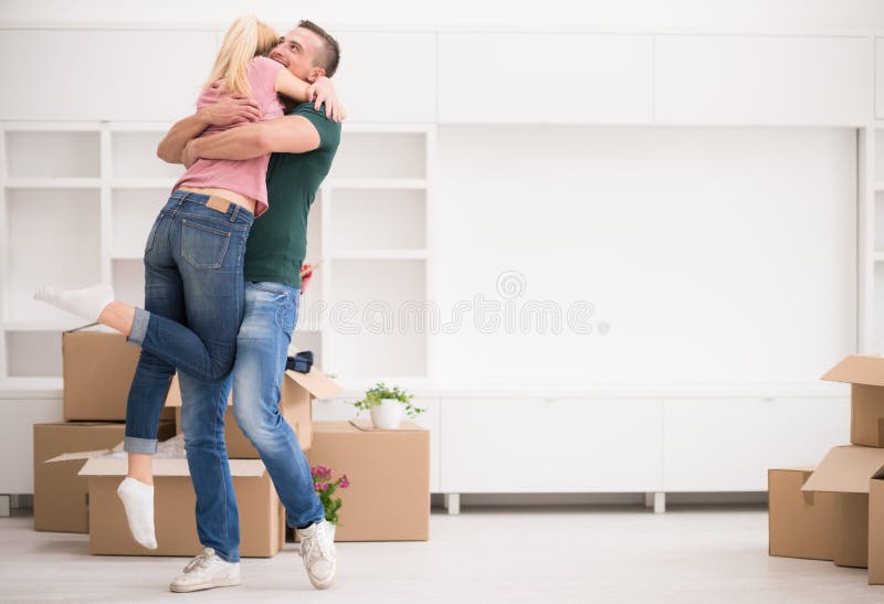 Happy Young couple moving in new house