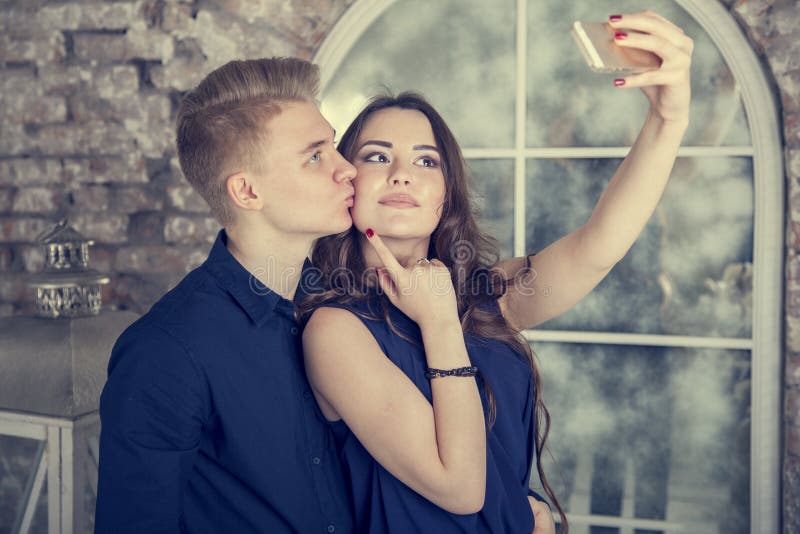 Sport man and woman making selfies. Happy couple hugging and posing for  camera Stock Photo by nd3000