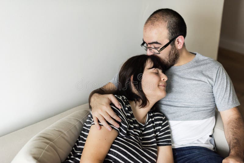 Happy young couple relaxing at home royalty free stock photos