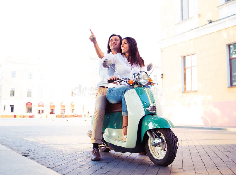 Happy Young Couple on Scooter Together Stock Photo - Image of leisure ...
