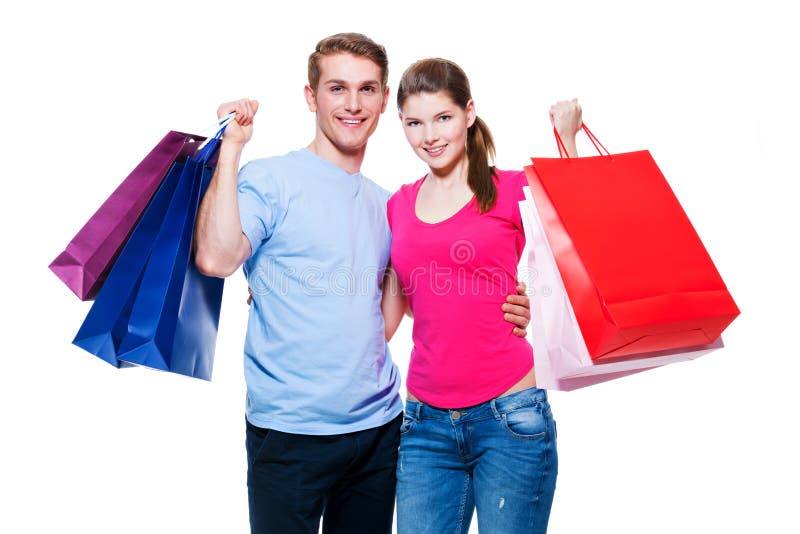 Happy young couple with shopping bags.