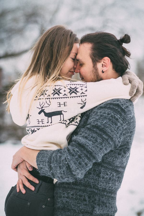 Happy Young Couple in Winter Park having fun.Family Outdoors. love royalty free stock photos Happy Young Couple in Winter Park having fun.Family Outdoors. love royalty free stock photos