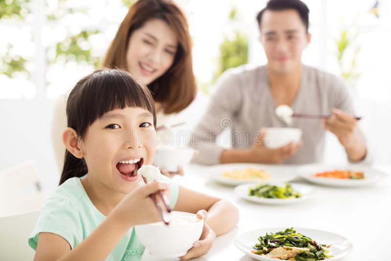 Happy Young Family Enjoy Their Dinner Stock Photo Image of mother
