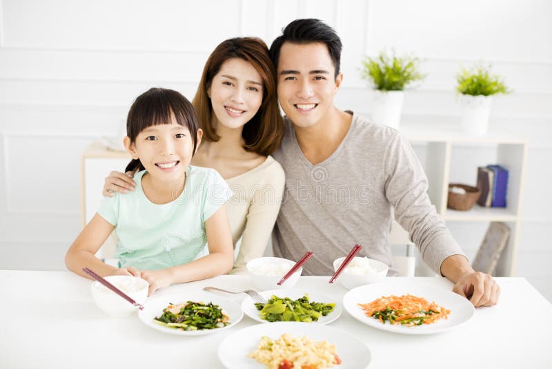 Happy young Family enjoy their dinner royalty free stock image Happy young Family enjoy their dinner royalty free stock image
