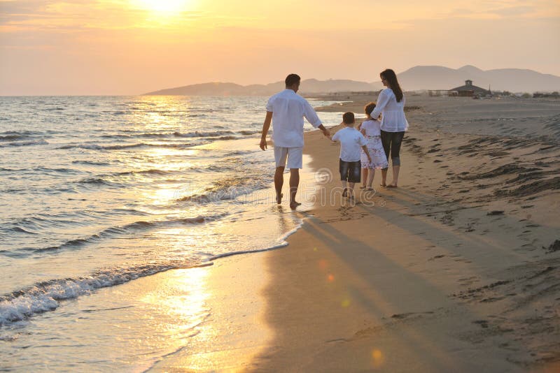 Happy young family have fun on beach