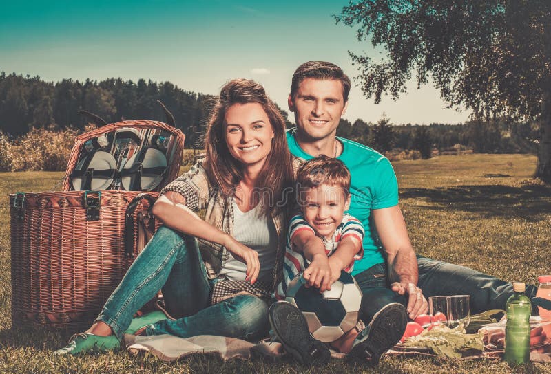 Happy young family outdoors royalty free stock photo Happy young family outdoors royalty free stock photo