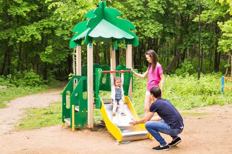 Happy young family spending time outdoor on a summer day royalty free stock photography Happy young family spending time outdoor on a summer day royalty free stock photography