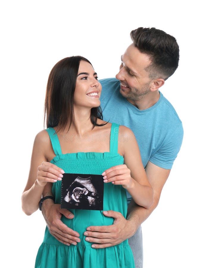 Happy young with ultrasound picture on white background stock photos Happy young with ultrasound picture on white background stock photos