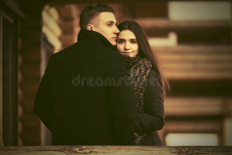 Happy young fashion couple on the porch of cottage royalty free stock photo Happy young fashion couple on the porch of cottage royalty free stock photo