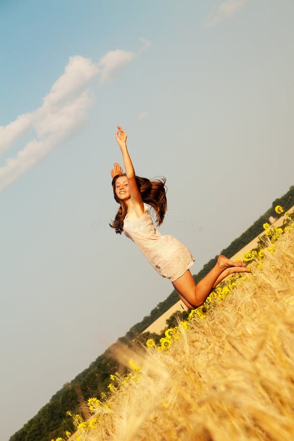 Happy young girl in field