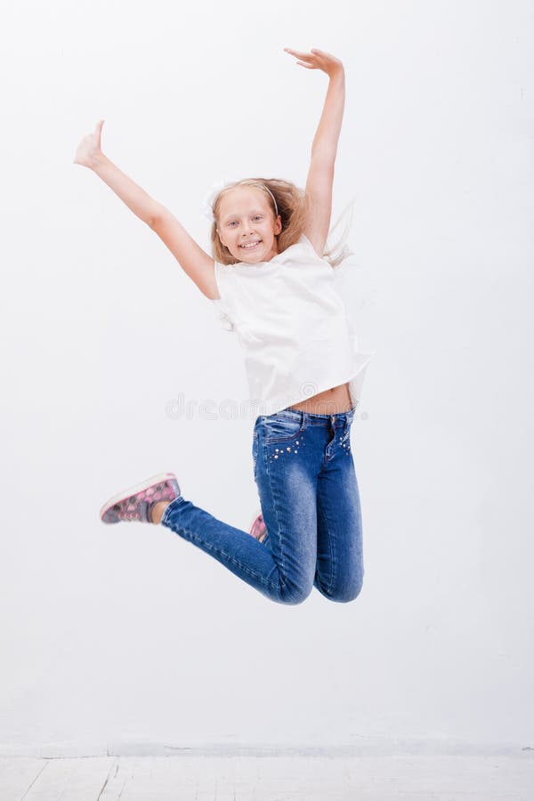 Happy Young Girl Jumping on White Background Stock Photo - Image of ...