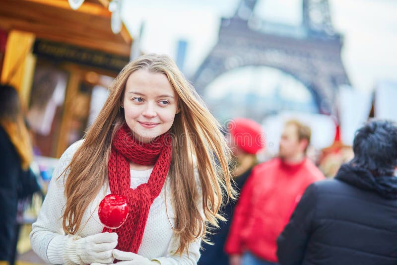 Happy young girl on a Parisian Christmas market