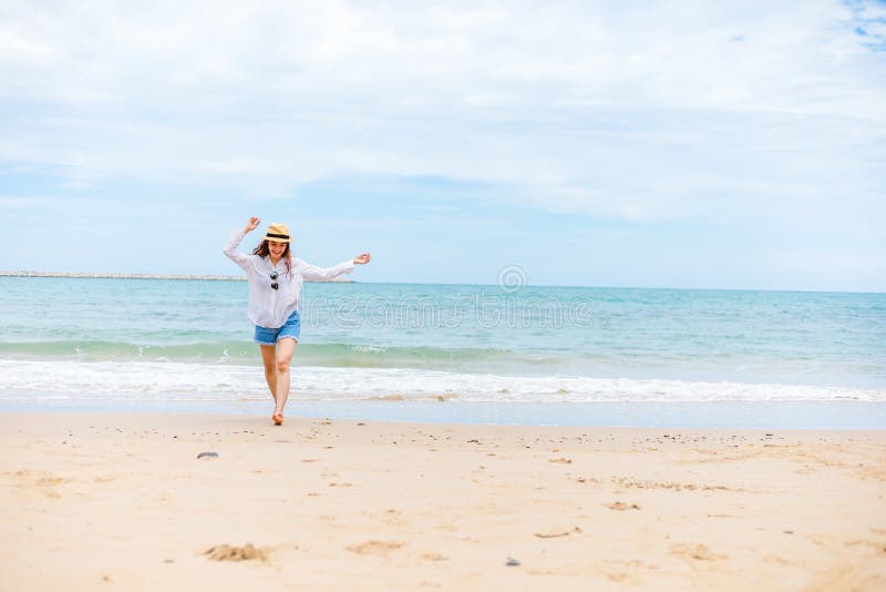 Happy Young Girl Walking on the Beach. Summer Travel, Vocation, Holiday ...