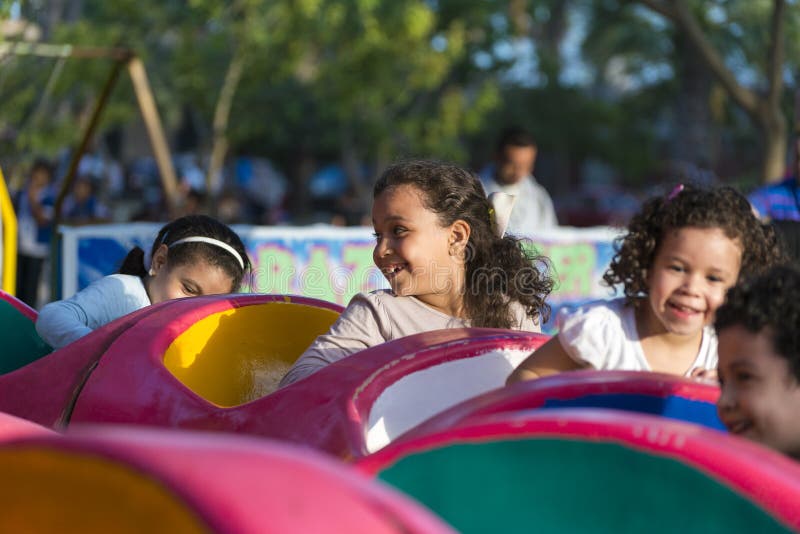 Happy Young Kids Having Fun at Amusement Park. Happy Young Kids Having Fun at Amusement Park