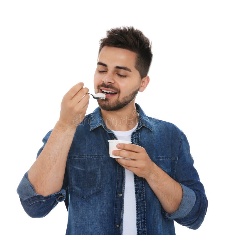 Happy Young Man Eating Tasty Yogurt on Background Stock Image Image