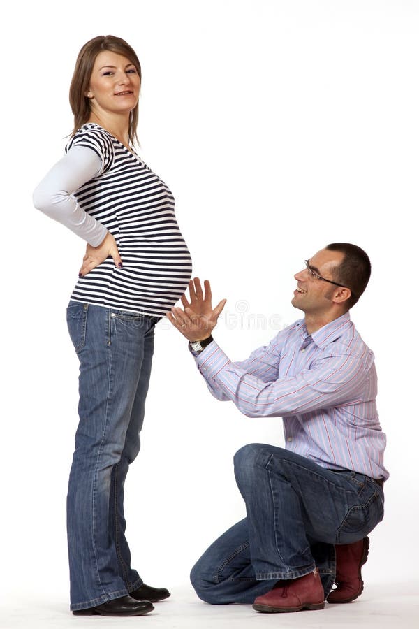 Happy young man and his pregnant wife