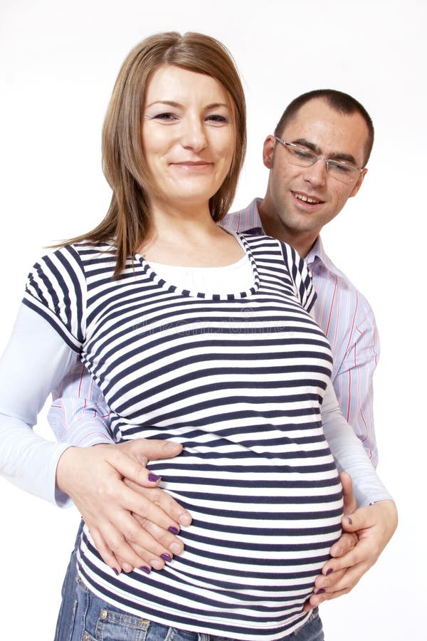 Happy young man and his pregnant wife stock photos Happy young man and his pregnant wife stock photos