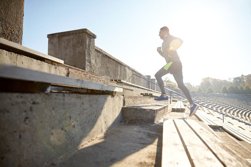 Happy Young Man Running Upstairs on Stadium Stock Image - Image of ...