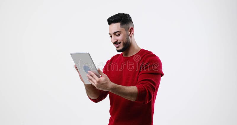 Happy young man using digital tablet stock footage