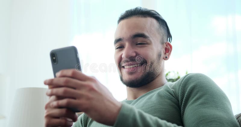 Happy young man using mobile phone stock video