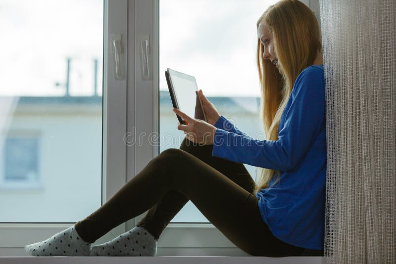 Young woman using tablet stock photos