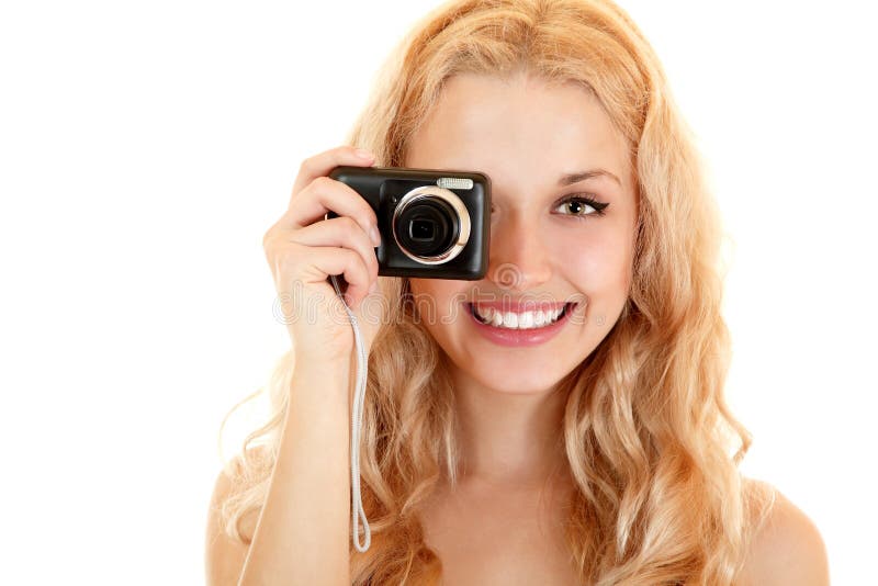 Happy young woman doing photos with still camera