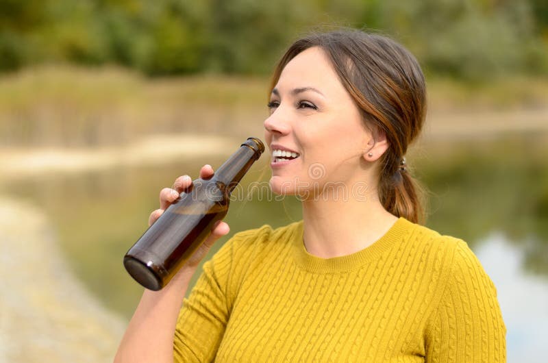 Happy Young Woman Drinking Beer At A Picnic Stock Image ...