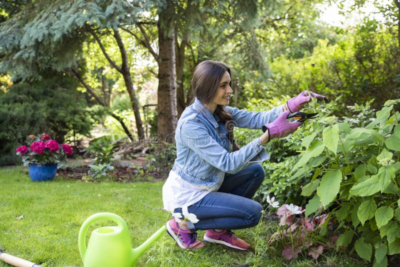 Happy Young Woman Gardening in the Backyard at Home Stock Image - Image ...