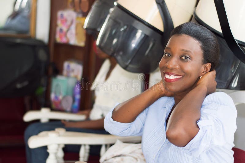 Happy young woman at the hair salon. royalty free stock images Happy young woman at the hair salon. royalty free stock images